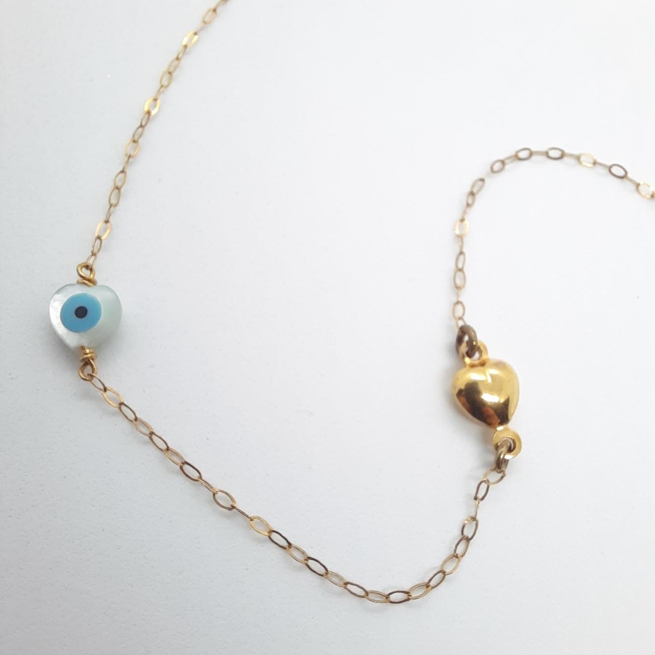 Χρυσό βραχιόλι Κ14 ματάκι και καρδιά