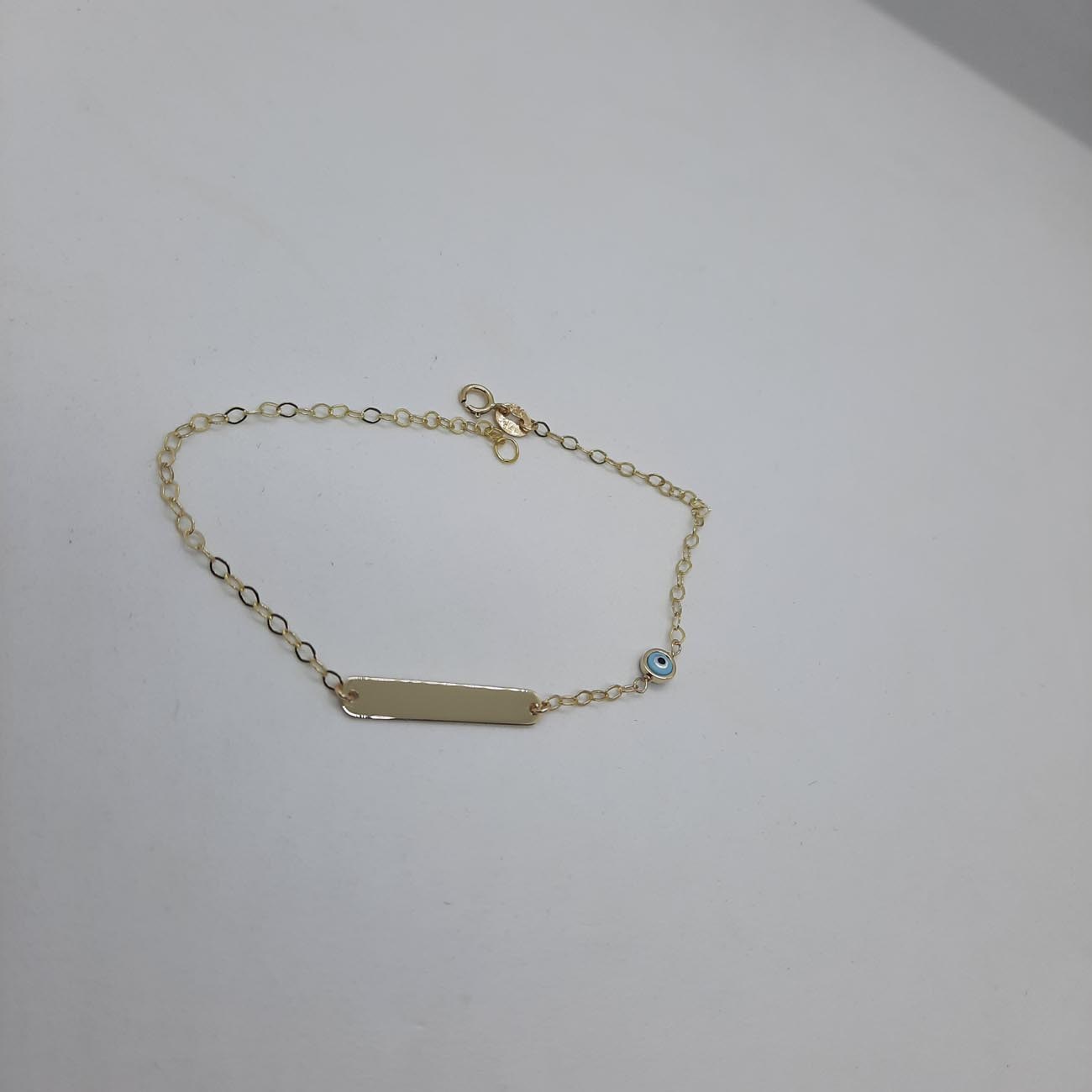 Χρυσή ταυτότητα γαλάζιο ματάκι