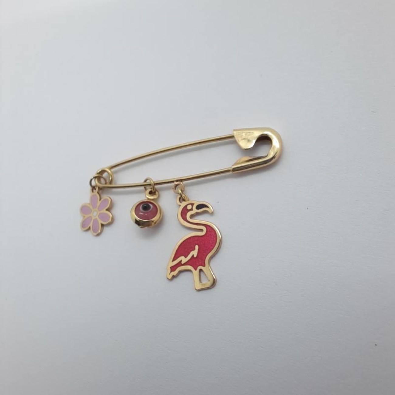 Χρυσό φυλακτό ροζ φλαμίνγκο