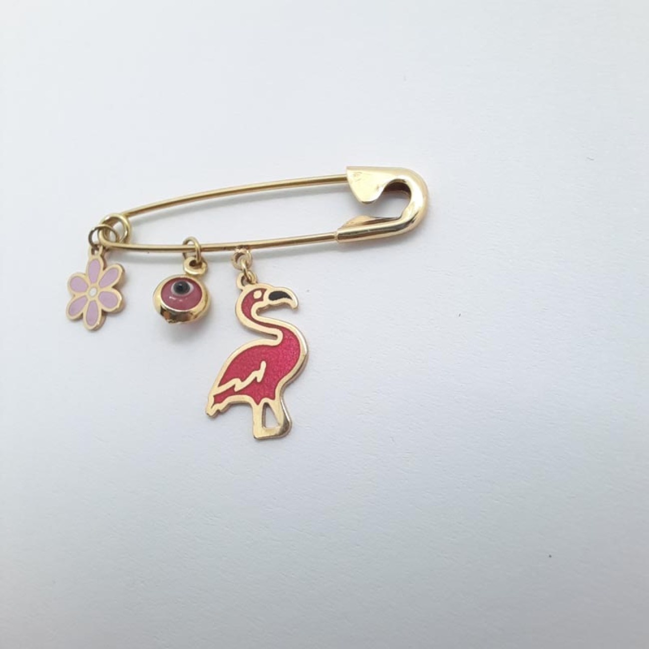 Χρυσό φυλακτό ροζ φλαμίνγκο