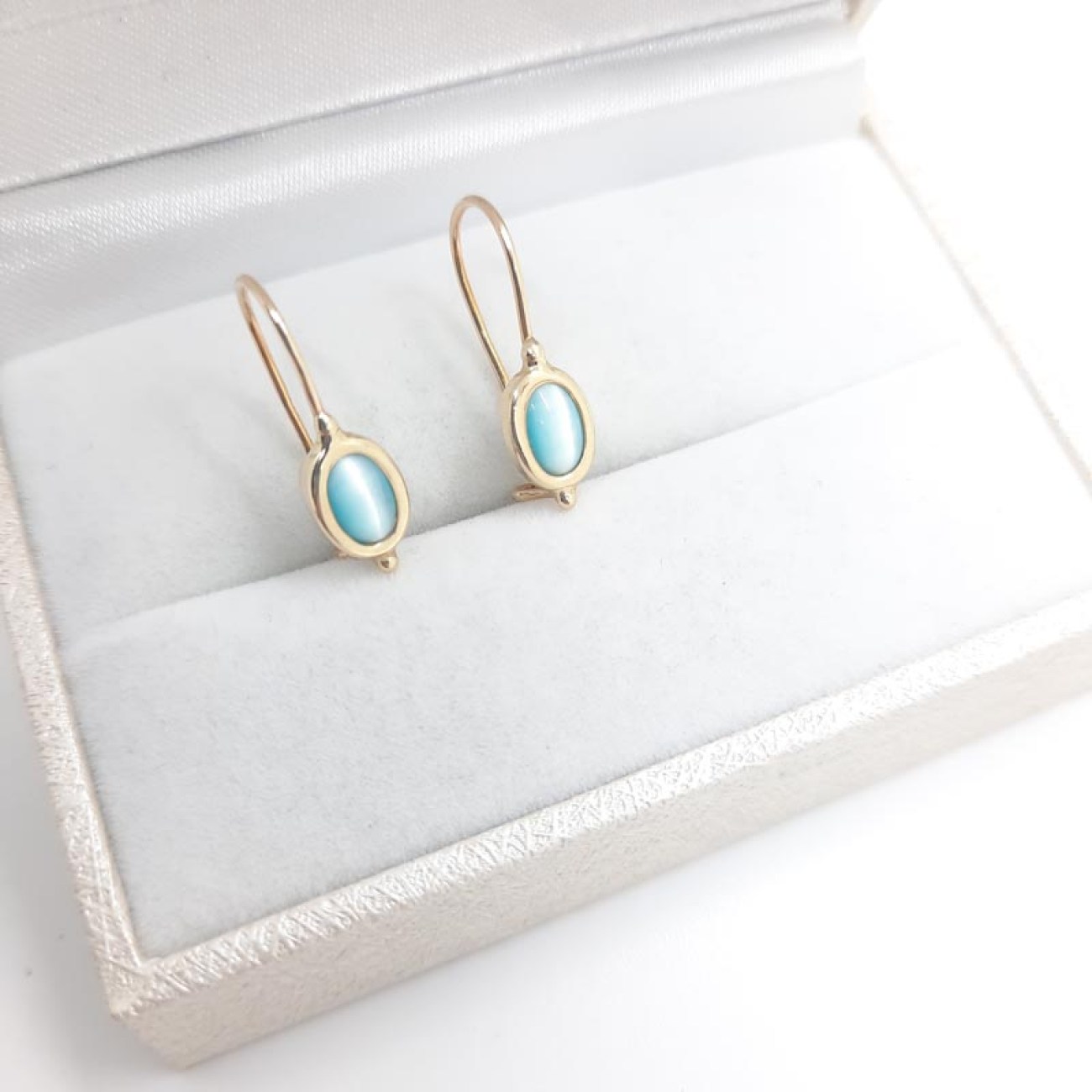 Χρυσά σκουλαρίκια Κ14 γαλάζια οβάλ