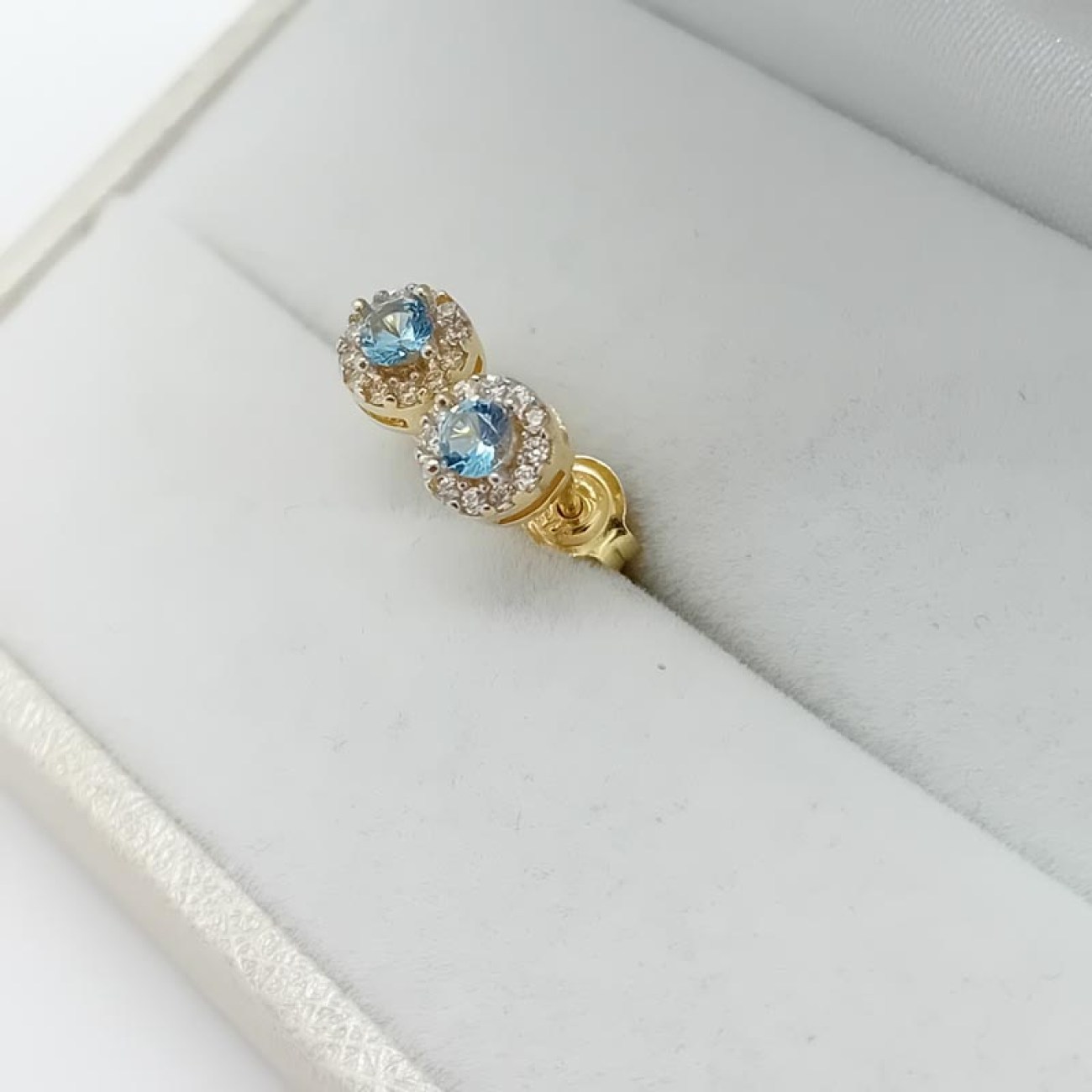 Χρυσά σκουλαρίκια κουμπωτά γαλάζιο ζιργκόν Κ9